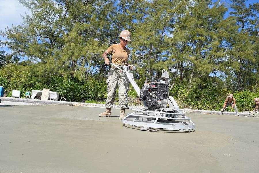 Power-trowel finishing a concrete slab