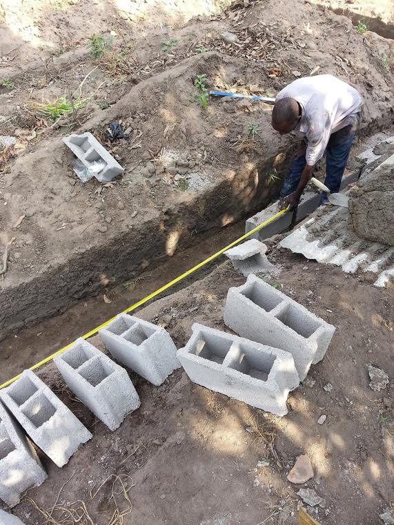 Setting block in a foundation trench